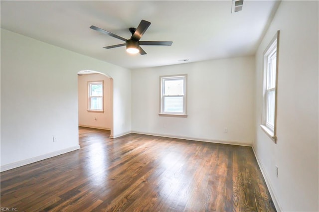 8014 E Glen Rd, Norfolk, VA 23505 - spare room with arched walkways, a ceiling fan, wood finished floors, and baseboards
