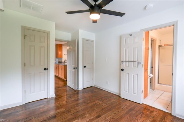 8014 E Glen Rd, Norfolk, VA 23505 - unfurnished bedroom featuring dark wood-style floors, ensuite bath, a sink, baseboards, and a ceiling fan
