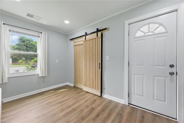 400 Cedar Dr, Hampton, VA 23669 - foyer entrance featuring a barn door, baseboards, wood finished floors, crown molding, and recessed lighting