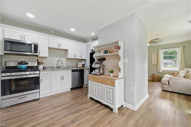 400 Cedar Dr, Hampton, VA 23669 - kitchen featuring stainless steel appliances, light wood-style flooring, open shelves, white cabinetry, and recessed lighting