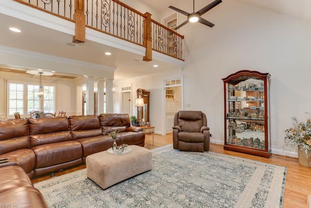 102 Ships Lndg, Carrollton, VA 23314 - living area with a high ceiling, wood finished floors, ceiling fan, ornamental molding, and baseboards