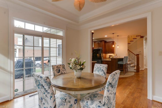 102 Ships Lndg, Carrollton, VA 23314 - dining space featuring stairway, light wood-type flooring, crown molding, baseboards, and a ceiling fan