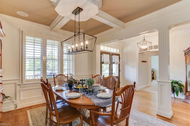 102 Ships Lndg, Carrollton, VA 23314 - dining room with decorative columns, a chandelier, beamed ceiling, light wood-style floors, and a decorative wall