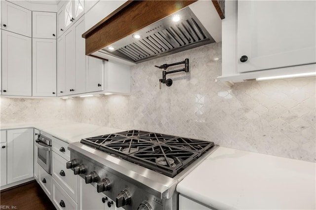 3527 Glencoe Ct, Chesapeake, VA 23322 - kitchen with premium range hood, white cabinetry, stainless steel appliances, and decorative backsplash
