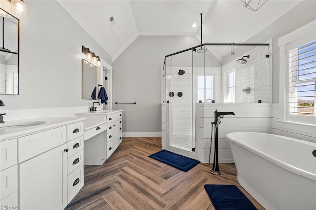 3527 Glencoe Ct, Chesapeake, VA 23322 - full bath with double vanity, a stall shower, a freestanding bath, vaulted ceiling, and baseboards