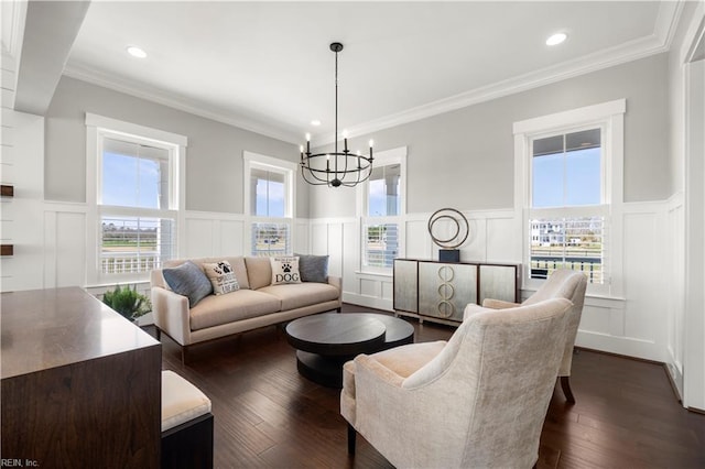 3527 Glencoe Ct, Chesapeake, VA 23322 - living room featuring a decorative wall, a chandelier, a wainscoted wall, ornamental molding, and dark wood finished floors