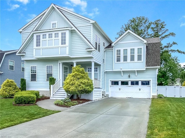 1920 Flintshire Dr, Chesapeake, VA 23323 - view of front of property with board and batten siding, a shingled roof, a garage, covered porch, and concrete driveway