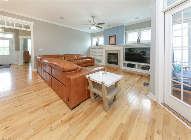 1920 Flintshire Dr, Chesapeake, VA 23323 - living room with light wood finished floors, ceiling fan, crown molding, and a glass covered fireplace