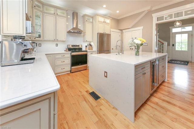 1920 Flintshire Dr, Chesapeake, VA 23323 - kitchen featuring wall chimney range hood, appliances with stainless steel finishes, ornamental molding, light wood-style floors, and wine cooler