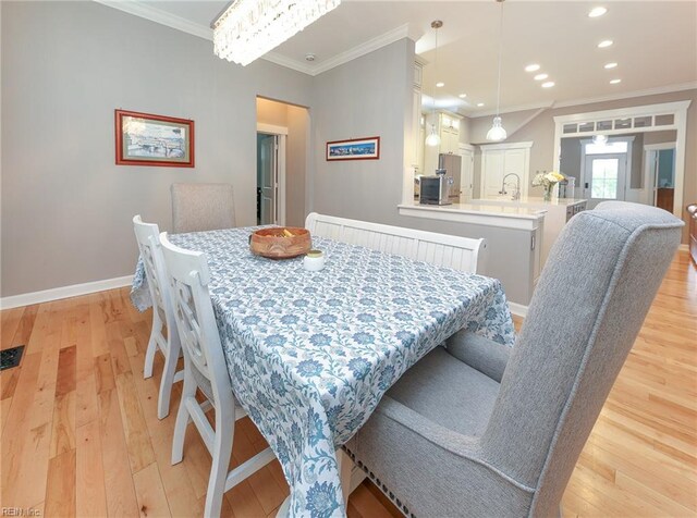 1920 Flintshire Dr, Chesapeake, VA 23323 - dining room featuring light wood-style floors, crown molding, baseboards, and recessed lighting