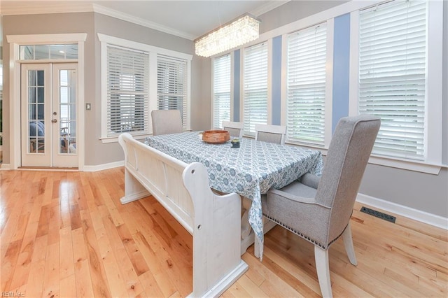 1920 Flintshire Dr, Chesapeake, VA 23323 - dining area with ornamental molding, light wood-style floors, baseboards, and french doors