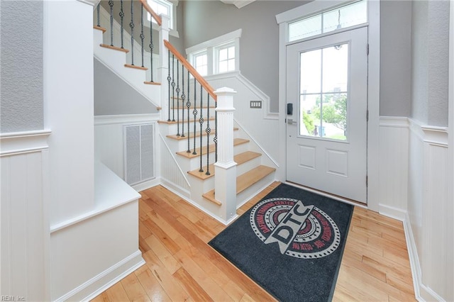 1920 Flintshire Dr, Chesapeake, VA 23323 - entryway with a decorative wall, hardwood / wood-style flooring, a wainscoted wall, and stairs