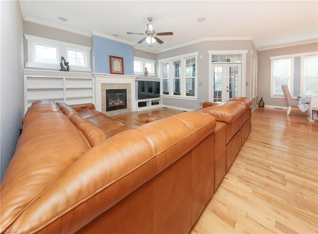 1920 Flintshire Dr, Chesapeake, VA 23323 - living room with light wood-style floors, ceiling fan, ornamental molding, a fireplace with flush hearth, and baseboards
