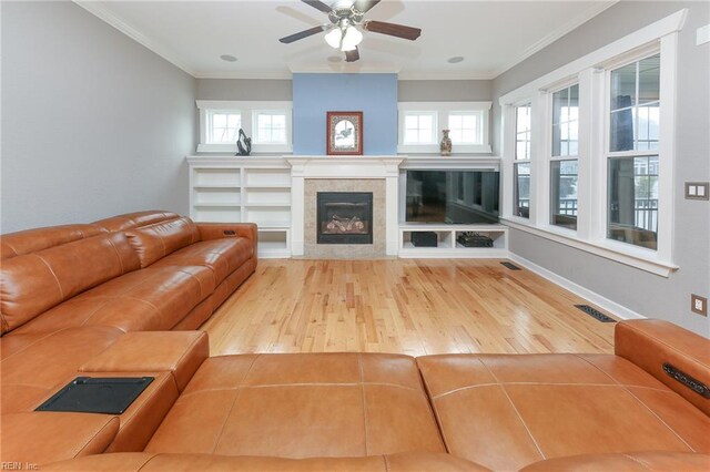 1920 Flintshire Dr, Chesapeake, VA 23323 - living room with hardwood / wood-style floors, a tile fireplace, ceiling fan, and crown molding