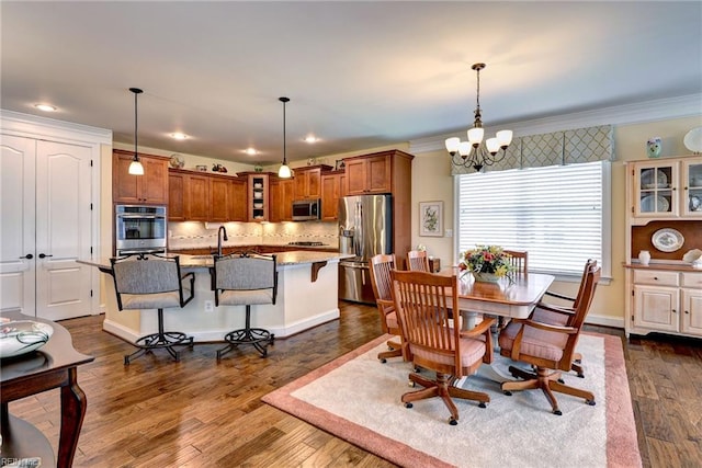 3907 Ethan Ln, Williamsburg, VA 23188 - dining room featuring a chandelier, crown molding, dark wood-style floors, recessed lighting, and baseboards