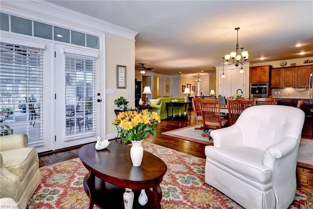 3907 Ethan Ln, Williamsburg, VA 23188 - living area with a chandelier, wood finished floors, crown molding, and a ceiling fan