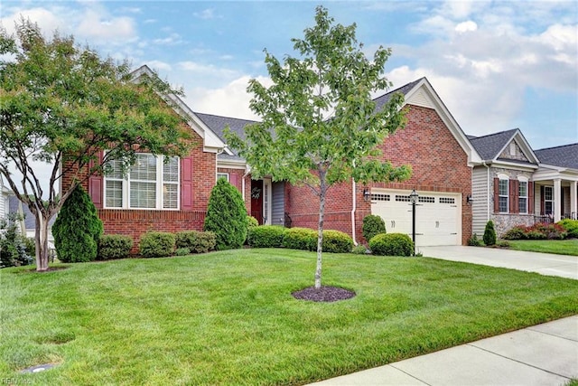 3907 Ethan Ln, Williamsburg, VA 23188 - view of front of home with brick siding, driveway, a front lawn, and an attached garage