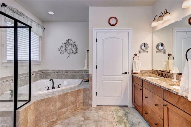 3907 Ethan Ln, Williamsburg, VA 23188 - bathroom with double vanity, a garden tub, and tile patterned flooring