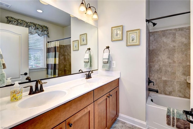3907 Ethan Ln, Williamsburg, VA 23188 - bathroom with double vanity, shower / bath combo with shower curtain, tile patterned flooring, and baseboards