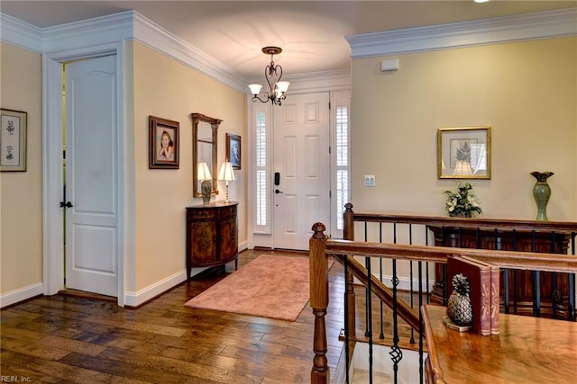 3907 Ethan Ln, Williamsburg, VA 23188 - foyer entrance featuring dark wood-type flooring, a chandelier, crown molding, and baseboards