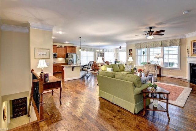 3907 Ethan Ln, Williamsburg, VA 23188 - living area with crown molding, ceiling fan, dark wood-style flooring, and a fireplace