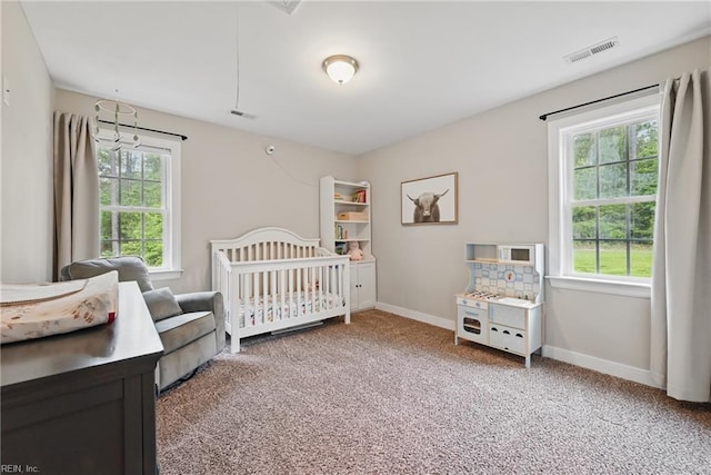 320 Pamunkey Ridge Rd, King William, VA 23086 - bedroom with carpet, baseboards, and a crib