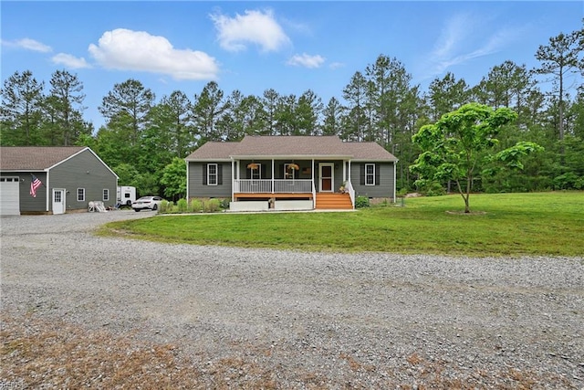 320 Pamunkey Ridge Rd, King William, VA 23086 - single story home with covered porch, a front yard, and driveway