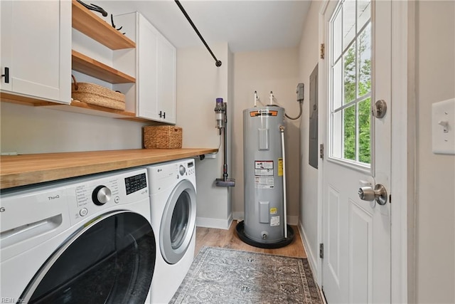 320 Pamunkey Ridge Rd, King William, VA 23086 - laundry room with water heater, independent washer and dryer, cabinet space, light wood-style flooring, and baseboards