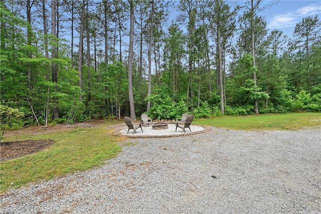 320 Pamunkey Ridge Rd, King William, VA 23086 - view of yard with an outdoor fire pit and a wooded view