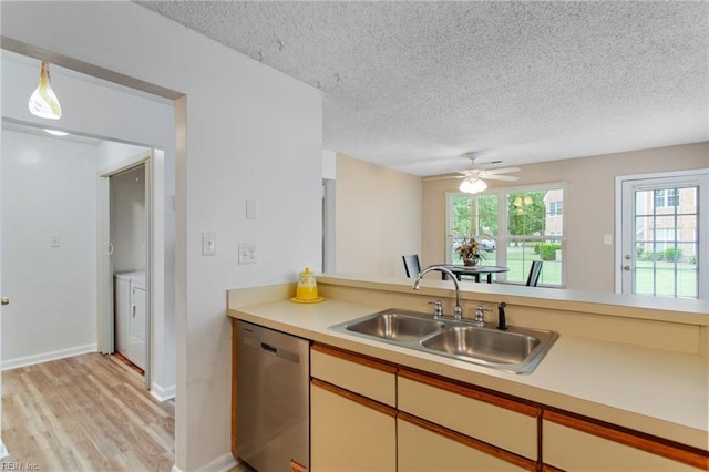 5113 Thatcher Way, Virginia Beach, VA 23456 - kitchen with dishwasher, a sink, separate washer and dryer, a textured ceiling, and light countertops