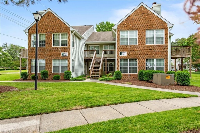 5113 Thatcher Way, Virginia Beach, VA 23456 - view of front of house with brick siding, stairway, and a front lawn