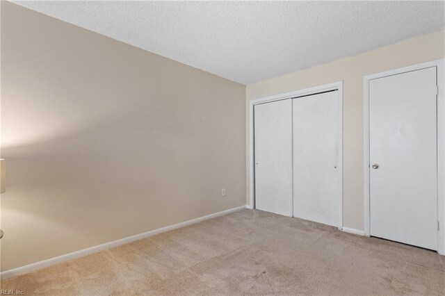 5113 Thatcher Way, Virginia Beach, VA 23456 - unfurnished bedroom with carpet flooring, a closet, a textured ceiling, and baseboards