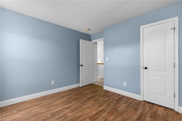 401 Fire Box Ct, Chesapeake, VA 23323 - unfurnished bedroom featuring baseboards and wood finished floors