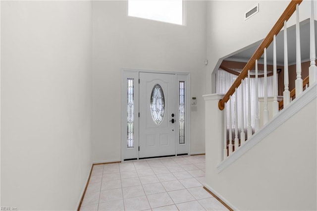 401 Fire Box Ct, Chesapeake, VA 23323 - entryway with stairway, a towering ceiling, light tile patterned floors, and baseboards