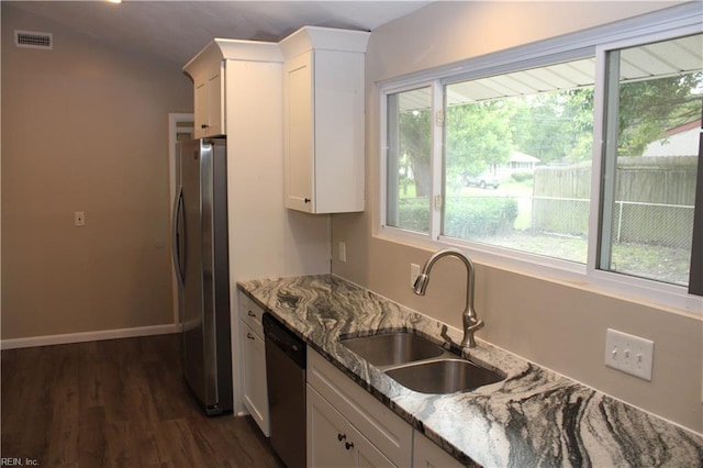 5857 Frament Ave, Norfolk, VA 23502 - kitchen featuring appliances with stainless steel finishes, a sink, plenty of natural light, and stone counters