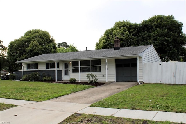 5857 Frament Ave, Norfolk, VA 23502 - ranch-style home with an attached garage, concrete driveway, and a chimney