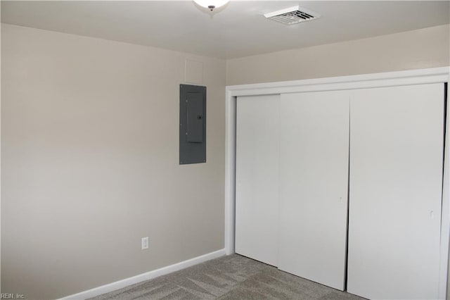 5857 Frament Ave, Norfolk, VA 23502 - unfurnished bedroom featuring electric panel, carpet, a closet, and baseboards