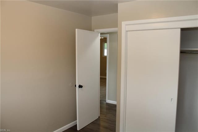 5857 Frament Ave, Norfolk, VA 23502 - unfurnished bedroom with baseboards, a closet, and dark wood-style flooring