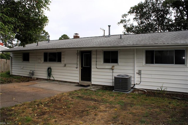 5857 Frament Ave, Norfolk, VA 23502 - back of property with central air condition unit, a chimney, a patio area, and roof with shingles