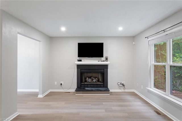 6218 Whaley Ct, Norfolk, VA 23502 - unfurnished living room with wood finished floors, a fireplace with raised hearth, recessed lighting, and baseboards
