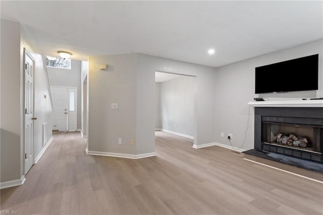 6218 Whaley Ct, Norfolk, VA 23502 - unfurnished living room featuring wood finished floors, baseboards, a fireplace with raised hearth, and recessed lighting