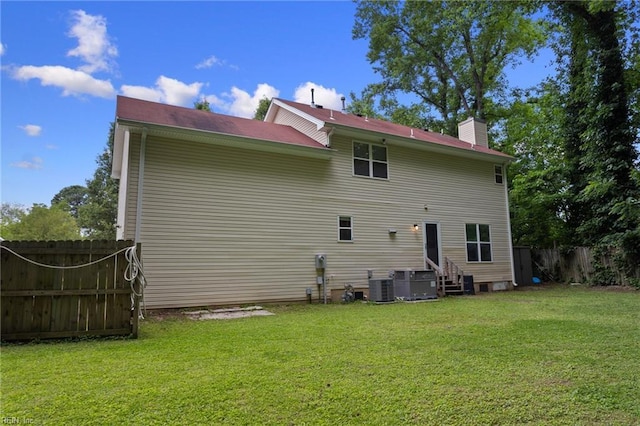 6218 Whaley Ct, Norfolk, VA 23502 - back of house with a chimney, central air condition unit, and entry steps