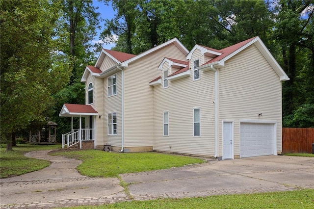 6218 Whaley Ct, Norfolk, VA 23502 - view of side of home with a garage, driveway, and view of wooded area