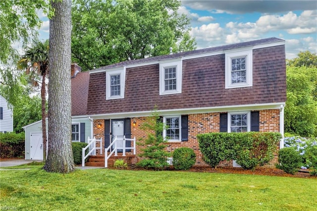 1321 Laurelfield Ct, Virginia Beach, VA 23454 - colonial inspired home with roof with shingles, a front yard, and brick siding
