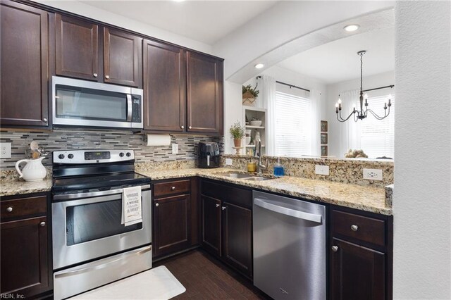 5516 Sadie Ln, Virginia Beach, VA 23462 - kitchen with appliances with stainless steel finishes, a sink, dark brown cabinets, backsplash, and recessed lighting