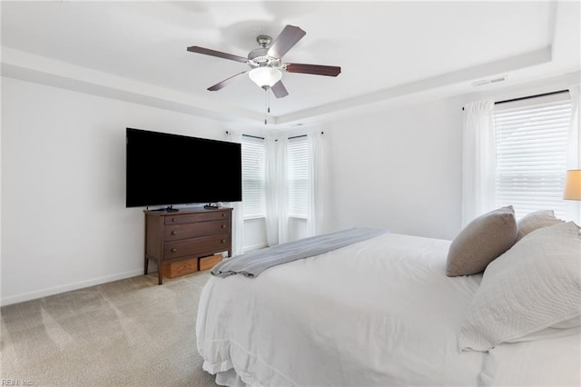 5516 Sadie Ln, Virginia Beach, VA 23462 - bedroom with light colored carpet, baseboards, a raised ceiling, and a ceiling fan
