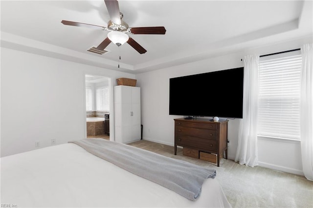 5516 Sadie Ln, Virginia Beach, VA 23462 - bedroom featuring a tray ceiling, light colored carpet, baseboards, a ceiling fan, and ensuite bath