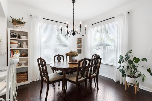 5516 Sadie Ln, Virginia Beach, VA 23462 - dining area with dark wood finished floors, a chandelier, and baseboards