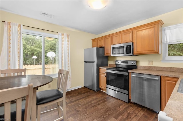 112 Hopemont Ln, Suffolk, VA 23434 - kitchen featuring stainless steel appliances, dark wood-style flooring, plenty of natural light, and light countertops
