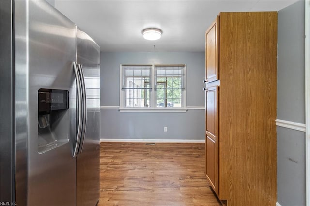 2 Sheralyn Pl, Hampton, VA 23666 - kitchen with stainless steel fridge, light wood finished floors, baseboards, and brown cabinets